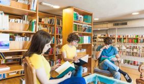 teenagers-reading-books-around-table